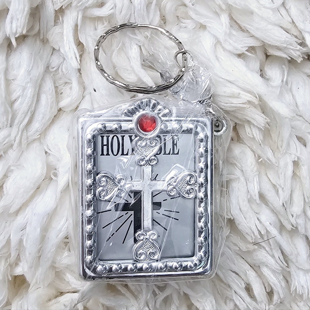 New portable Bible keychain with real pages and scriptures in silver tone